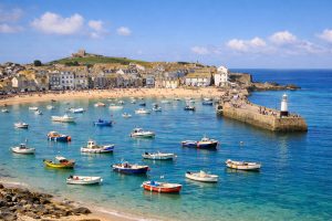 St Ives town and harbour on the Cornwall coast with colourful boats and sandy beach
